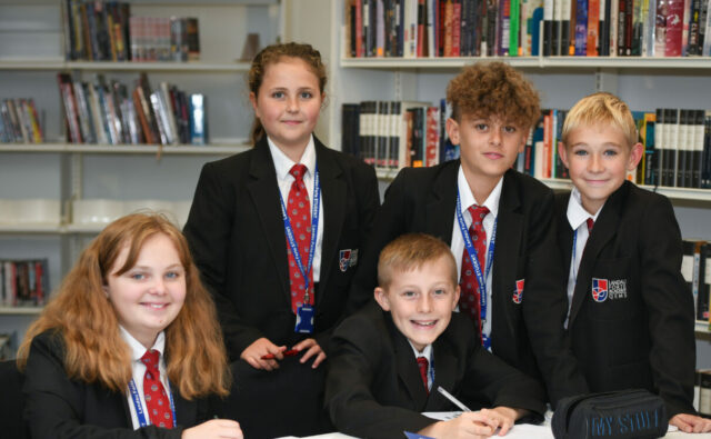 QEMS students in the library.